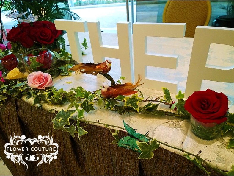 Reception Table - Ivy vines, roses, birds.